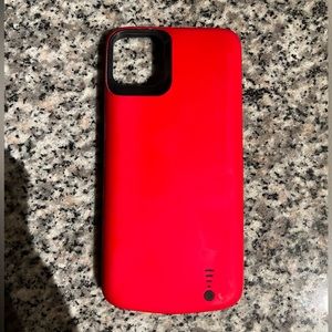 Used red 11 Pro Max charging case
